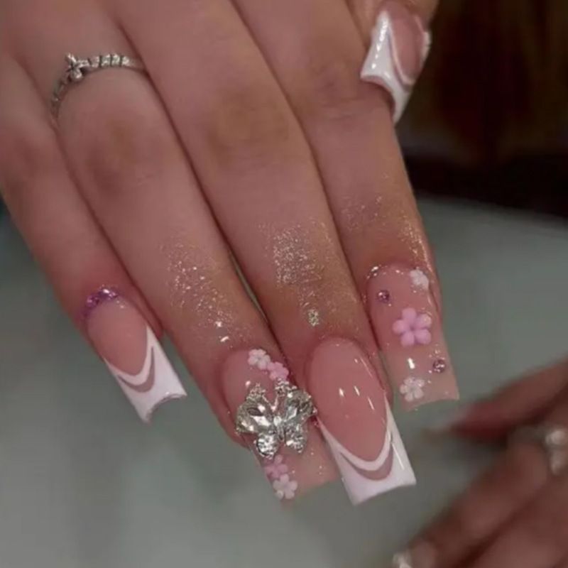 Artificial nails with floral accents and glitter effects Kalsten
