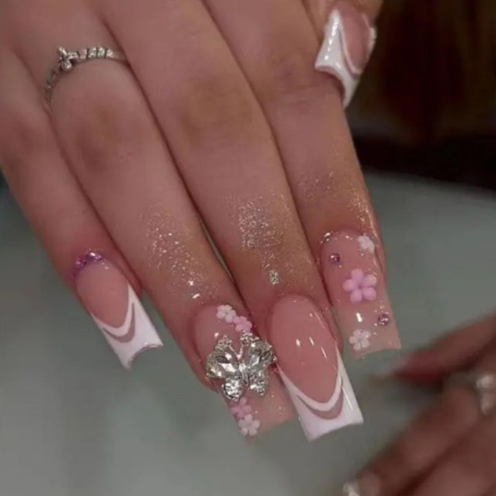 Artificial nails with floral accents and glitter effects Kalsten