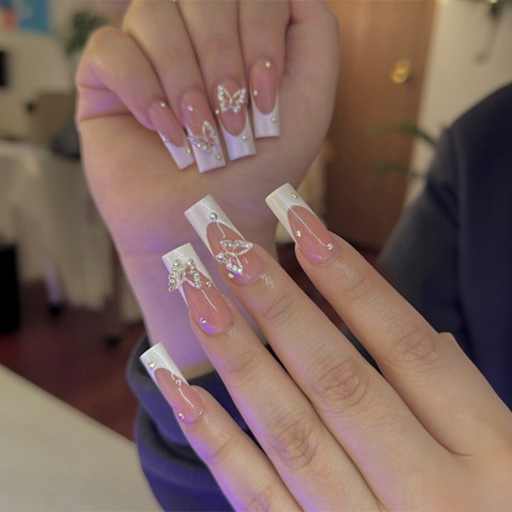 Artificial nail set with luxurious glitter and delicate floral designs Kalsten