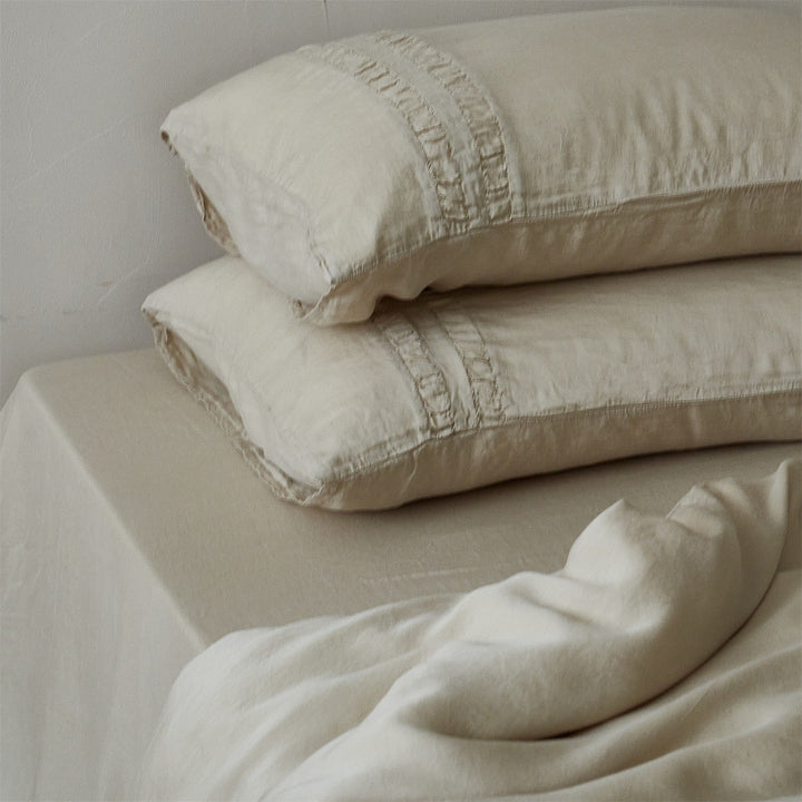Linen bedding set with stonewash finish and delicate ruffle inserts