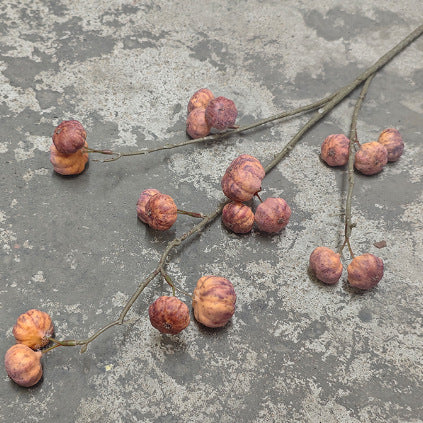 Artificial decorative branch with dried-looking pumpkin balls and flexible wire stem