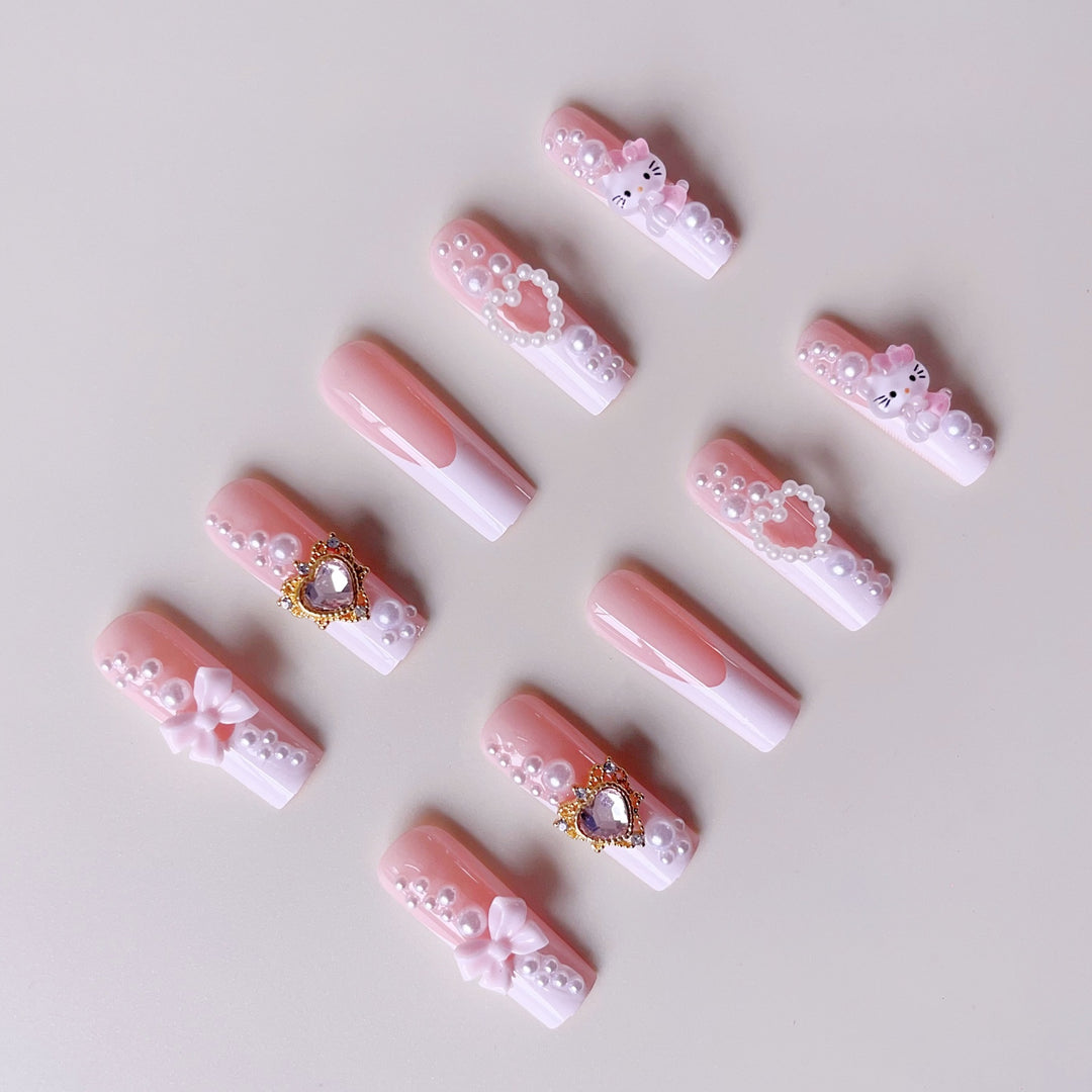 Glamorous artificial nails with 3D decorations and pearl accents Kalsten