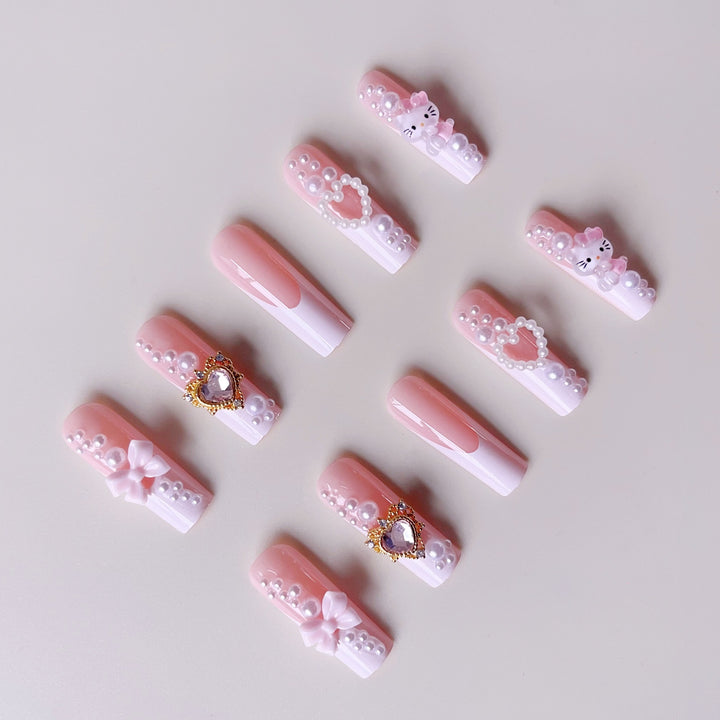 Glamorous artificial nails with 3D decorations and pearl accents Kalsten