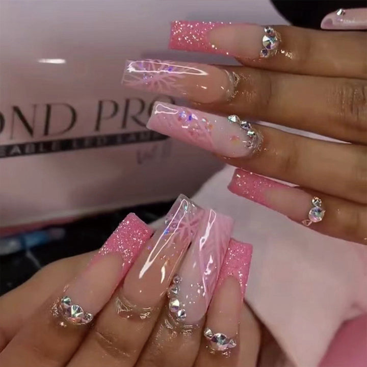 Artistic stiletto nails with glitter and snowflake design Kalsten