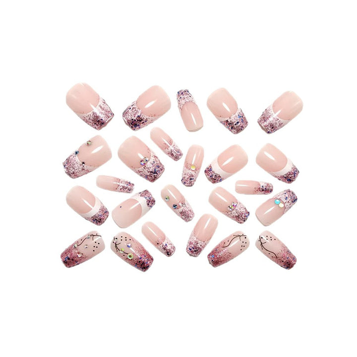 Glamorous artificial nails with glitter and rhinestone embellishments Kalsten
