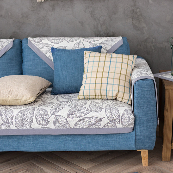 Washable non-slip sofa cover for three-seater couch with leaf pattern