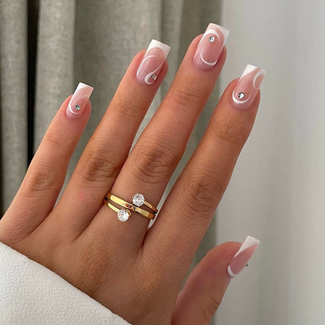 Artificial nail set with elegant French tips and glamorous rhinestone decorations Kalsten