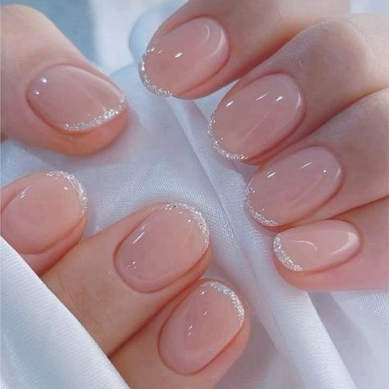 Acrylic nail set with elegant French tip and glitter accents Kalsten