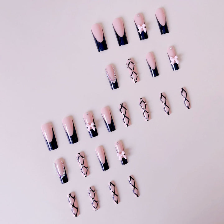 Artificial nail set with glamorous rhinestone and bow accents Kalsten