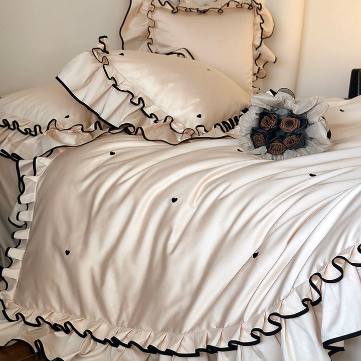 Cotton satin bed set with double-layer ruffled trim, contrast edge and heart embroidery