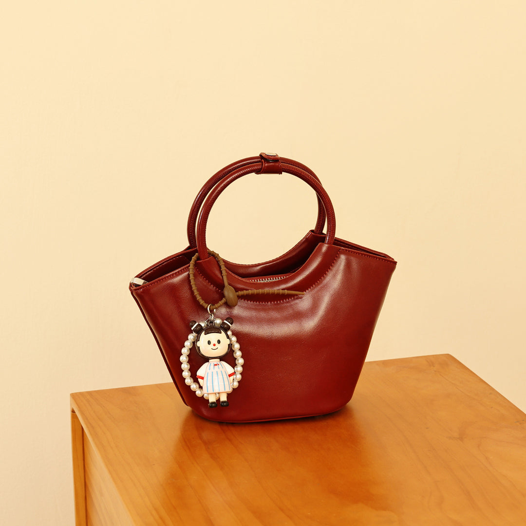 Chic Structured Handbag with Decorative Charm