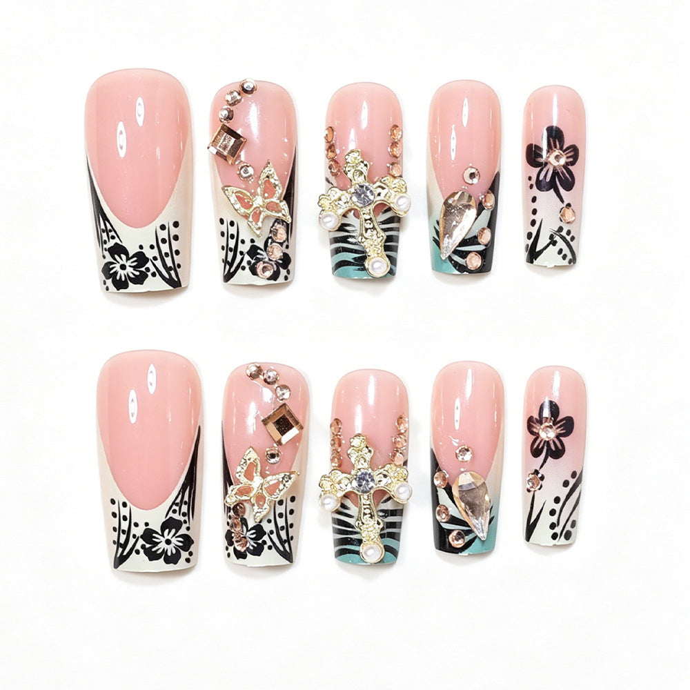 Artistic Stiletto Nail Design with Floral Accents and Gems Kalsten