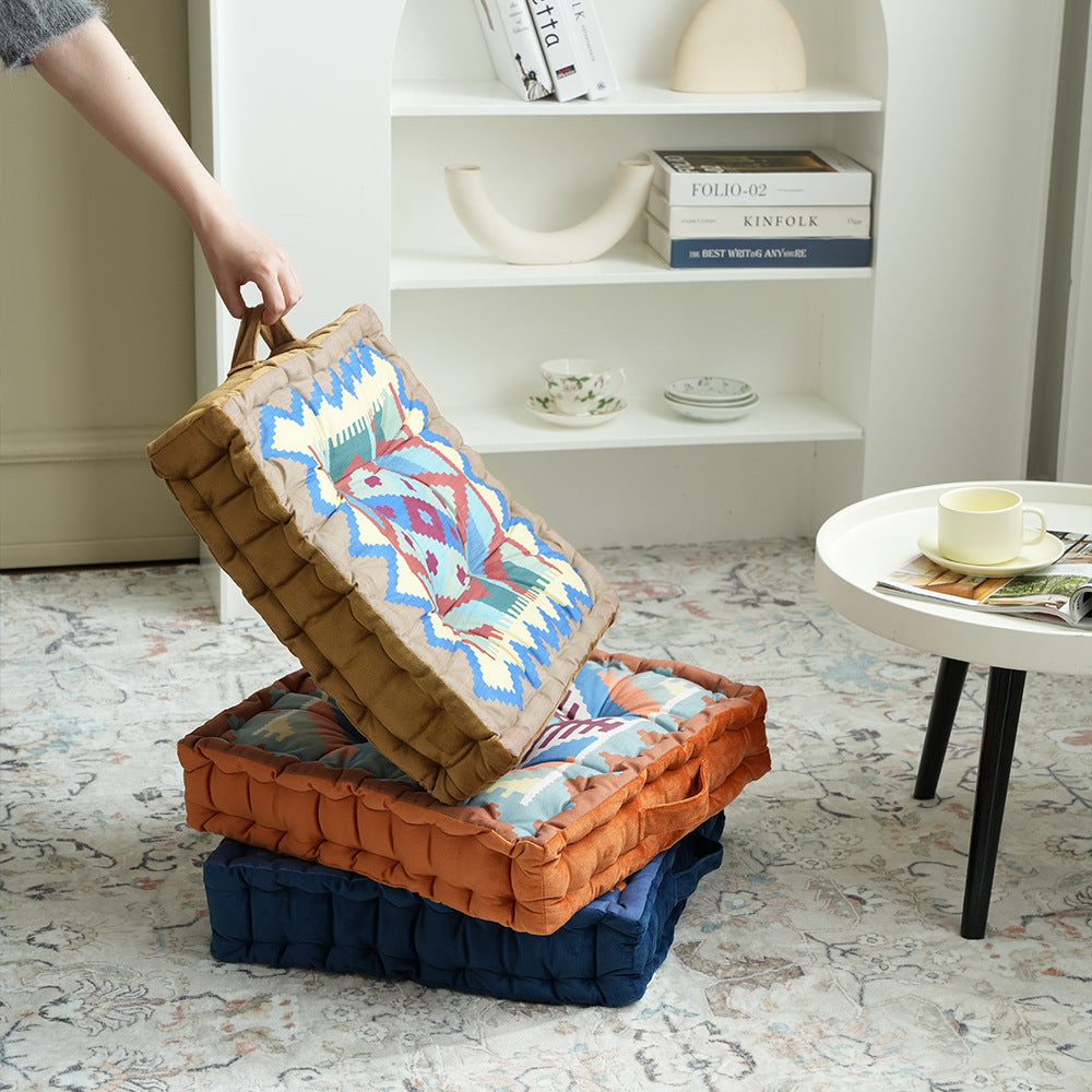 Padded seat and floor cushion with carrying handle and graphic ethno pattern Kalsten