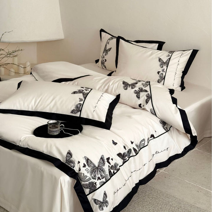 Luxurious cotton satin bedding set with butterfly embroidery and contrasting piping Kalsten