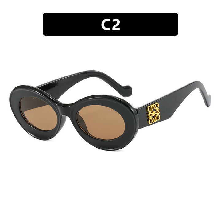 Women's fashionable sunglasses with oval frame and golden accents Kalsten