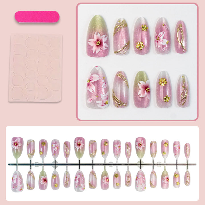 Artificial nails with floral design and gold accents Kalsten