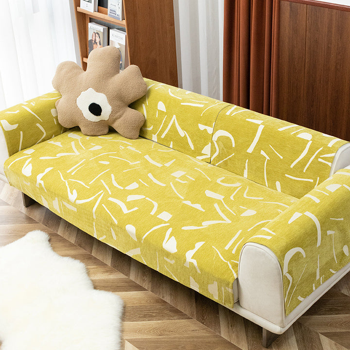 Removable sofa cover with abstract graphic print and elastic fitting edge