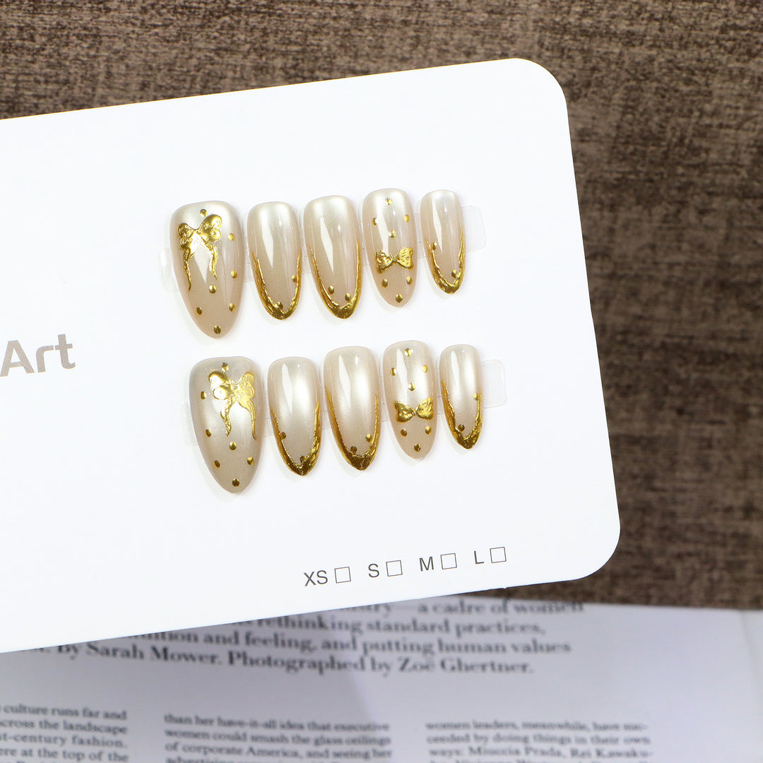 Elegant Press-On Nail Art with Golden Bow Accents Kalsten