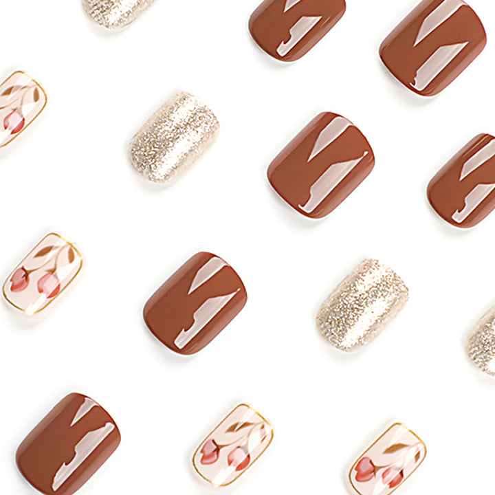 Artificial nail art with colorful flower design and glitter accents Kalsten