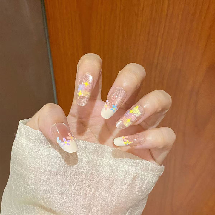 Artificial nails with delicate floral accents and glitter effects Kalsten
