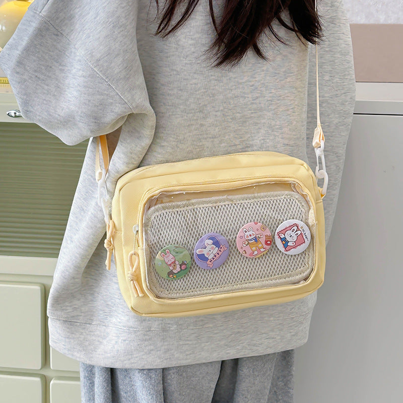 Shoulder bag with transparent viewing pocket and playful graphic design Kalsten