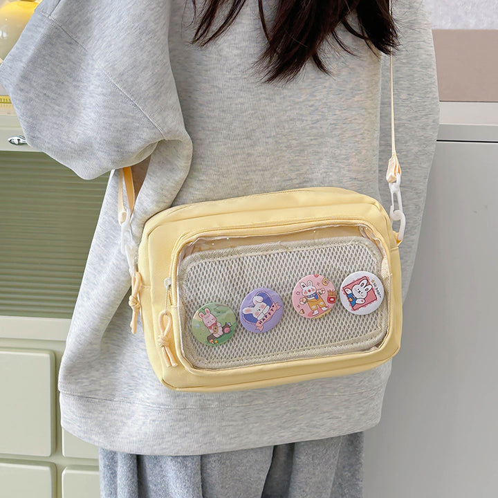 Shoulder bag with transparent viewing pocket and playful graphic design Kalsten