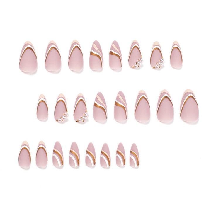 Artful stiletto nails with elegant gold and white accents Kalsten