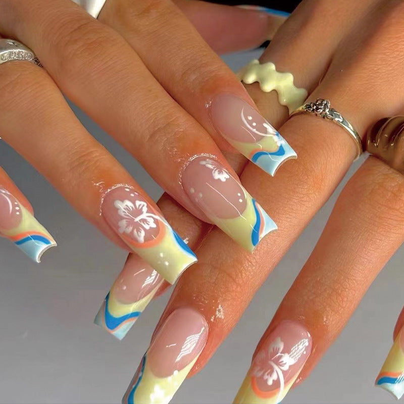 Artistic nail art with floral accents and creative color layers Kalsten