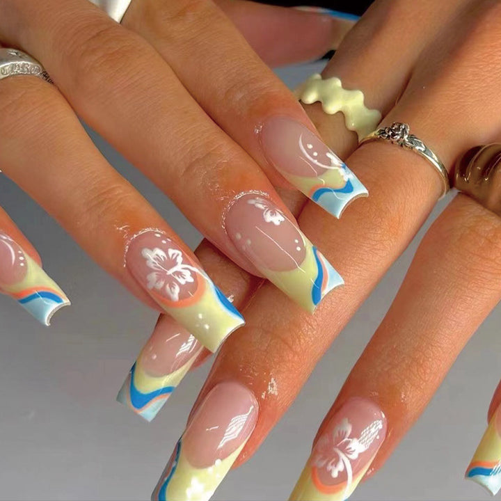 Artistic nail art with floral accents and creative color layers Kalsten