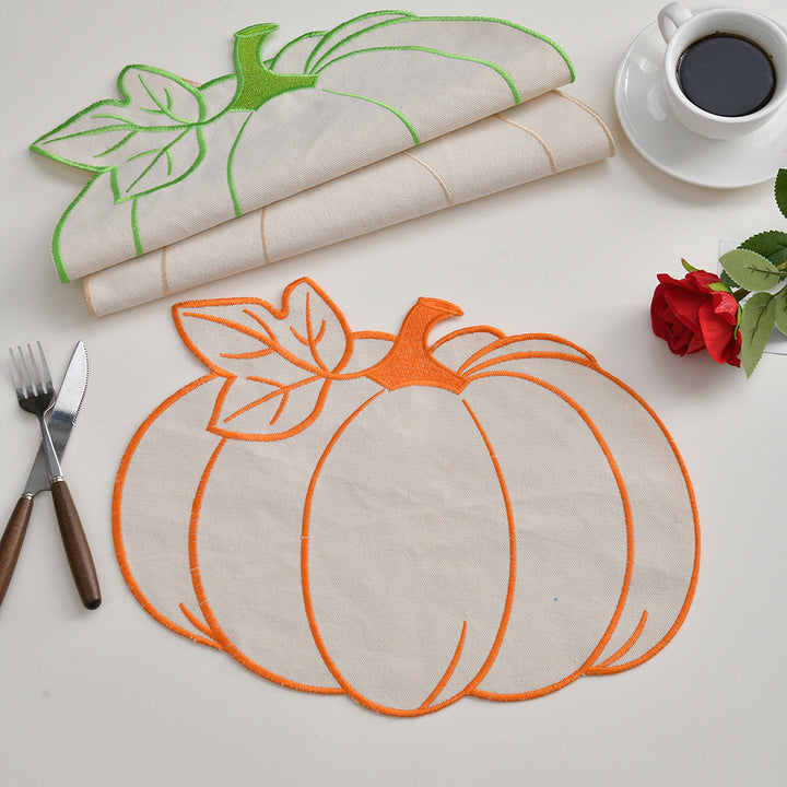 Seasonal table mat placemat made of linen in pumpkin silhouette with colorful embroidered border