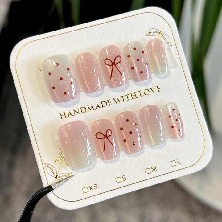 Artificial nail art with cute bow design Kalsten