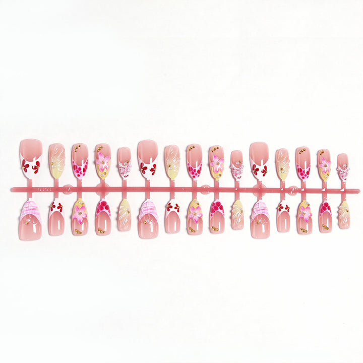 Artificial nails with floral accents and glitter decorations Kalsten