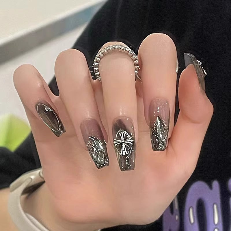 Glamorous artificial nails with heart design and glittering accents Kalsten