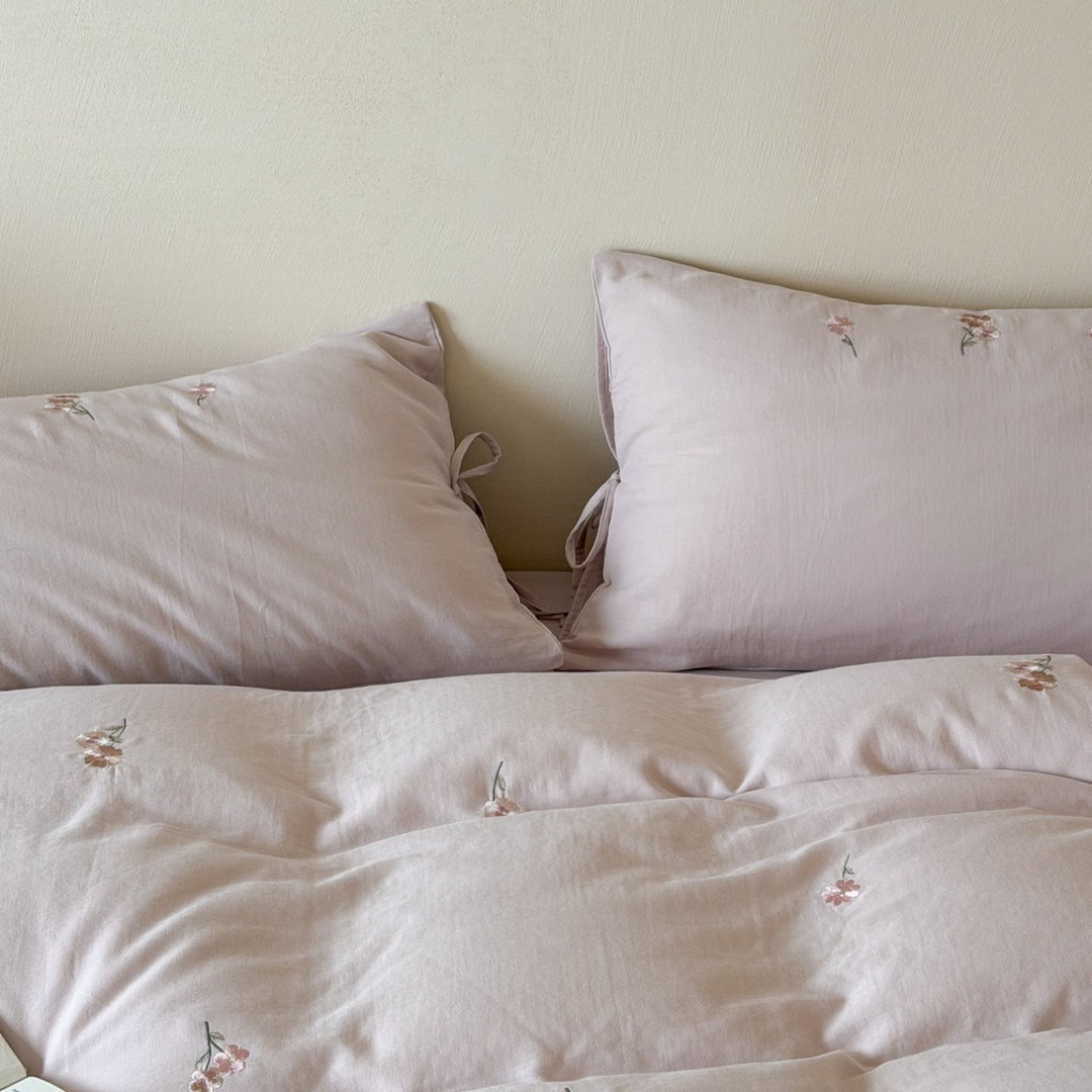 Embroidered cotton bedding set with delicate floral embroidery and tie bands