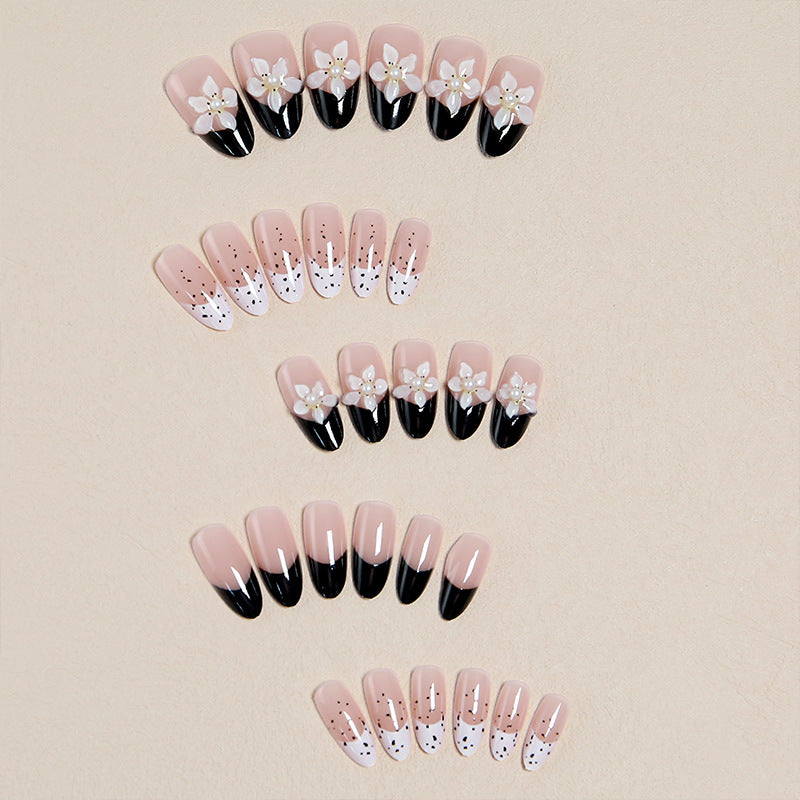 Artful nail tips with floral embellishments Kalsten