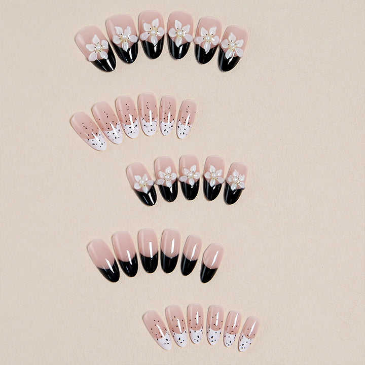 Artful nail tips with floral embellishments Kalsten