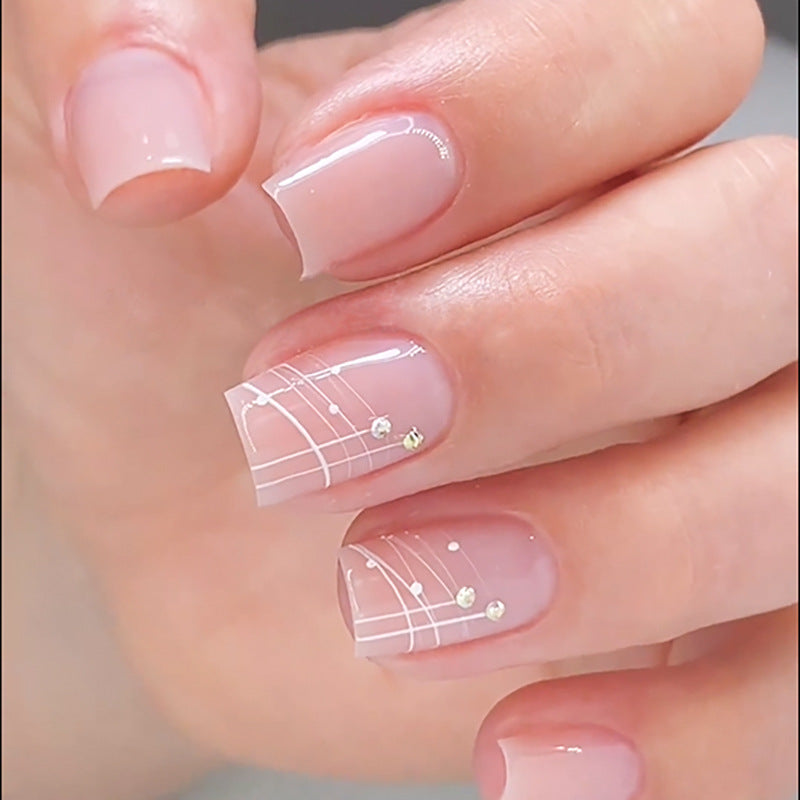 Artful nail extensions with elegant design and rhinestone embellishments Kalsten