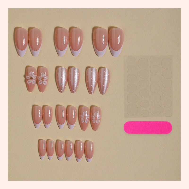 Artificial nail set with elegant French tips and delicate floral accents Kalsten