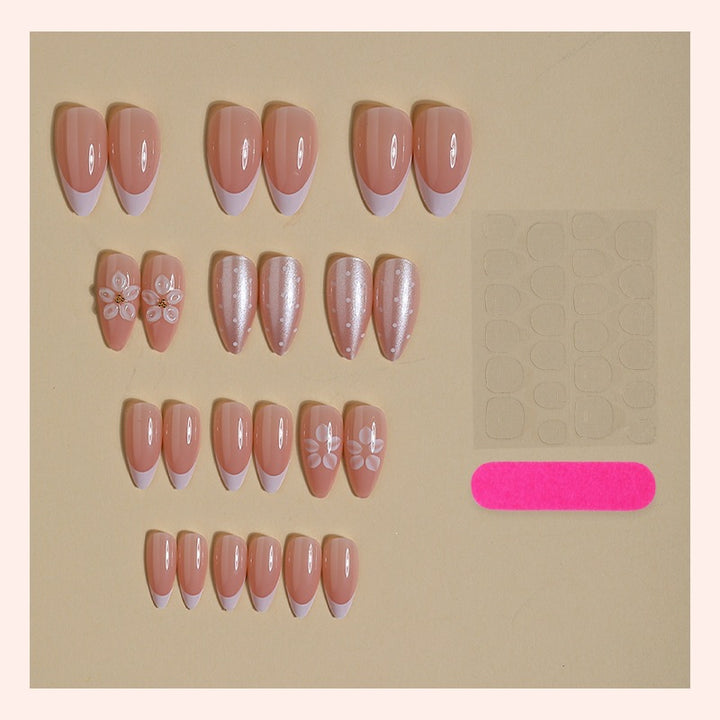 Artificial nail set with elegant French tips and delicate floral accents Kalsten