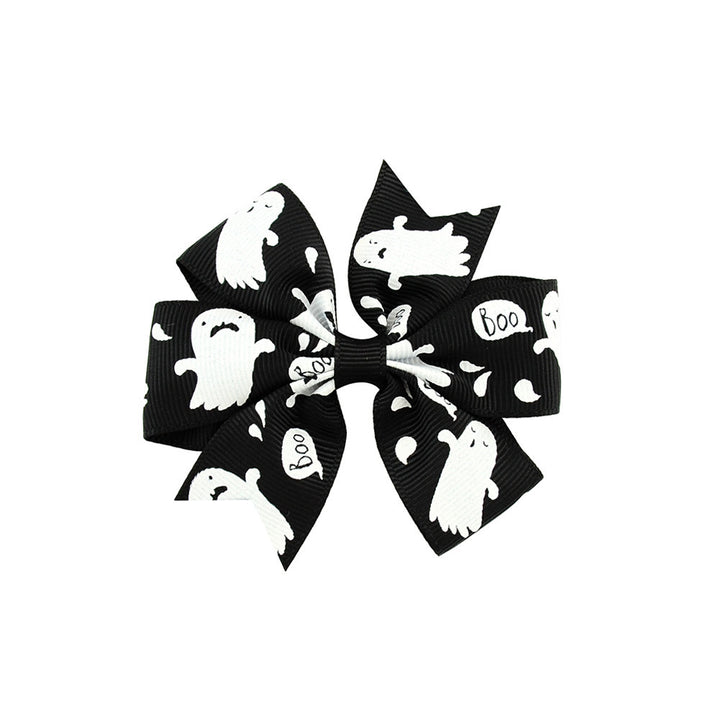 Halloween bow with pumpkin and witch motifs