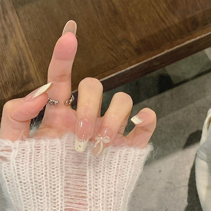 Artificial nails with elegant tip embellishment and romantic details Kalsten
