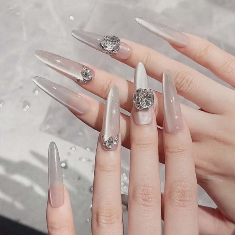 Acrylic nail set with glitter design and elegant 3D applications Kalsten
