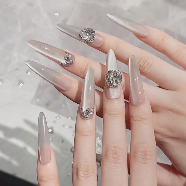 Acrylic nail set with glitter design and elegant 3D applications Kalsten