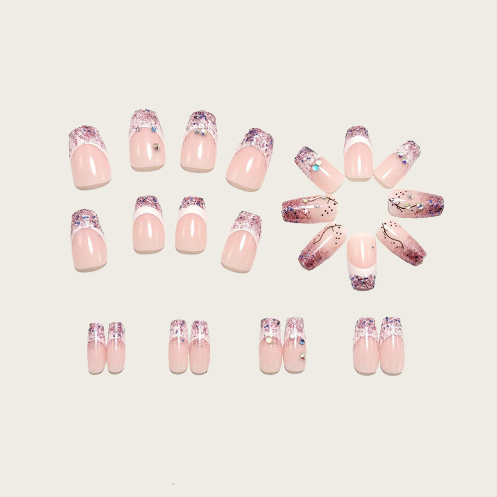 Glamorous artificial nails with glitter and rhinestone embellishments Kalsten