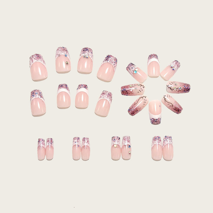 Glamorous artificial nails with glitter and rhinestone embellishments Kalsten
