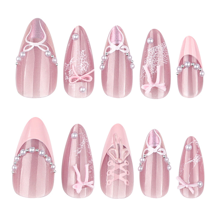 Artful nail extensions with delicate bow motifs Kalsten