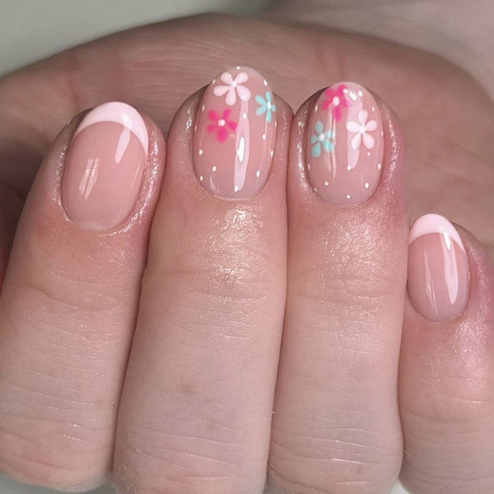 Artful nail extensions with colorful floral designs and glitter Kalsten