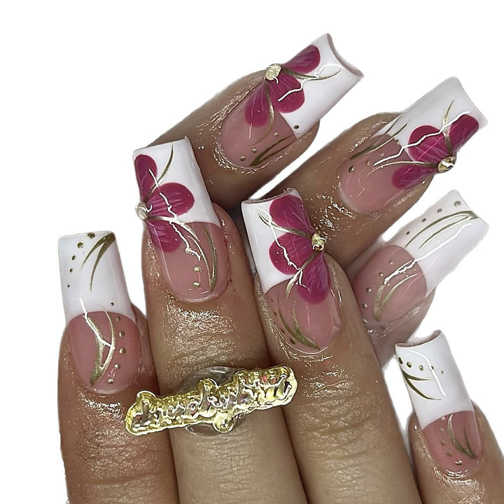 Artificial nail set with floral detail and glitter accents Kalsten