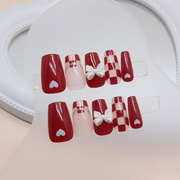 Artificial nails with decorative heart and bow details Kalsten