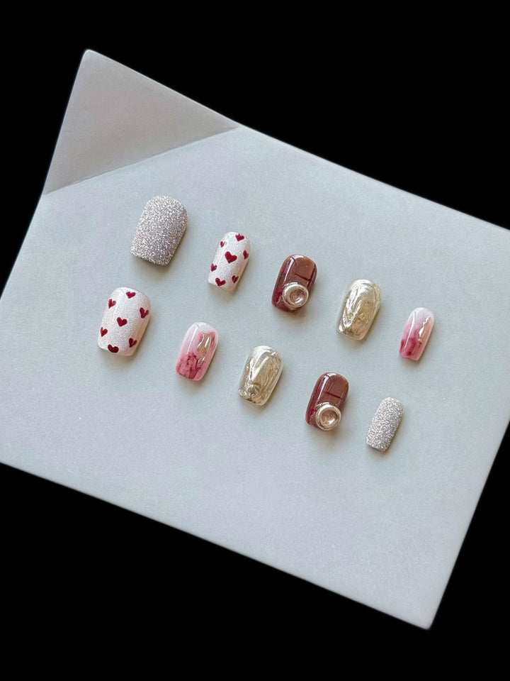 Artistic Press-On Nail Set with Heart and Glitter Accents